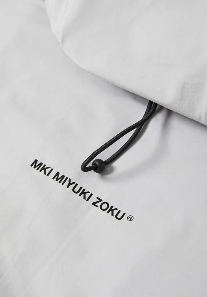 Shop MKI LIGHTWEIGHT SHELL HOODED JACKET Light Grey MKI MIYUKI ZOKU Outerwear